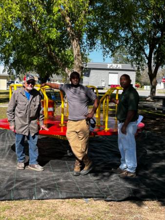 City of Alma work crew posing with new playground equipment